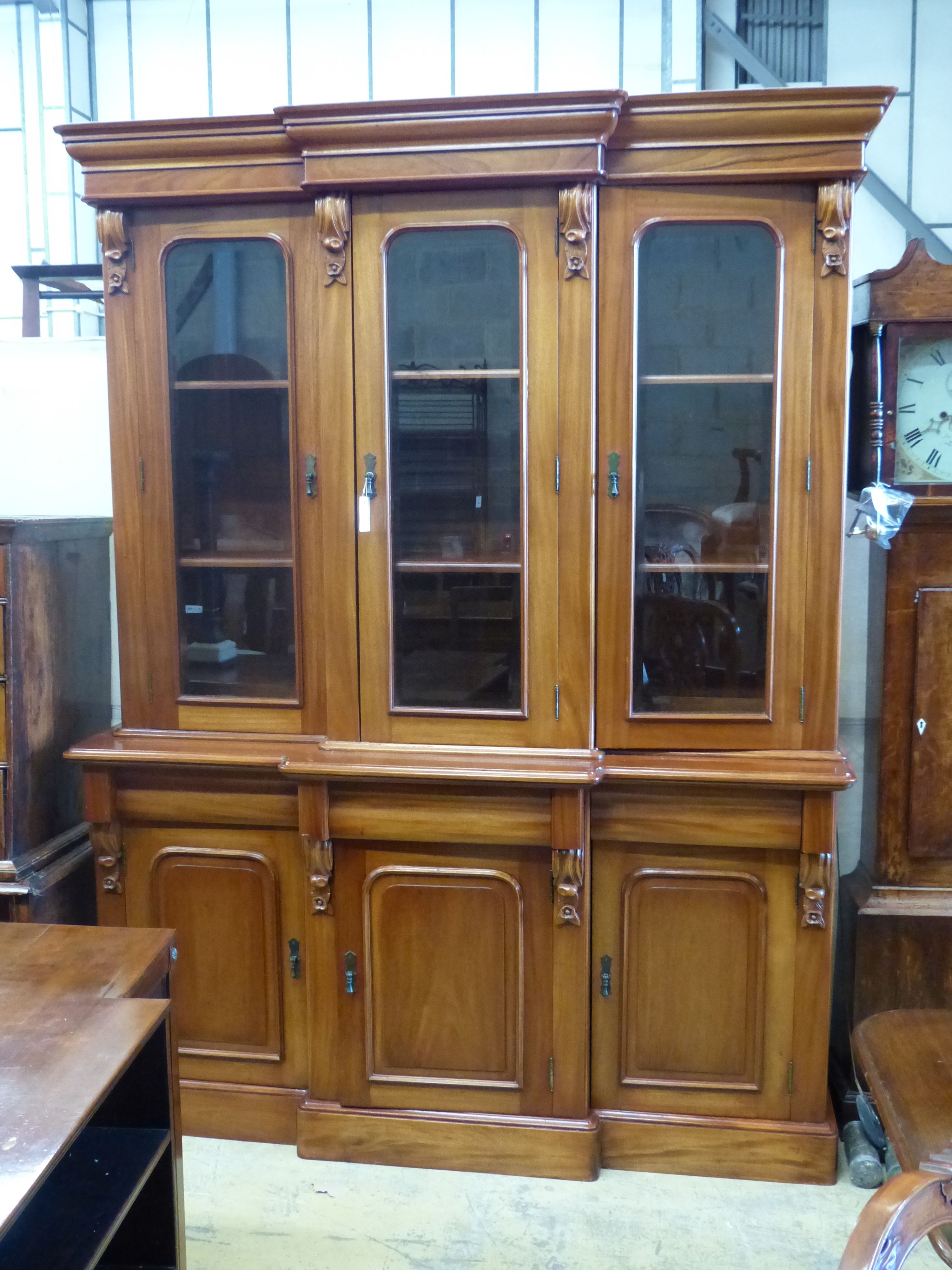 A Victorian style mahogany breakfront library bookcase, length 164cm, depth 48cm, height 218cm